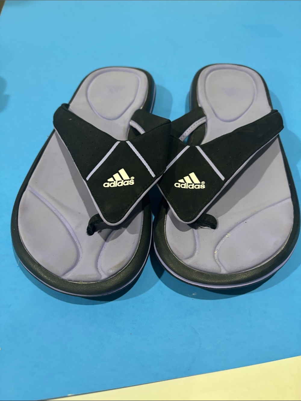 Adidas Black and Purple Women’s Comfort Flip Flops.